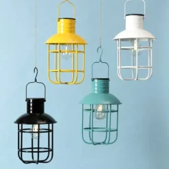 Outdoor Lighting-Kirkland's Home Hanging Cage Solar Powered Lantern Yellow